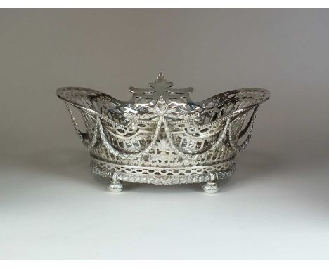 A William Comyns Victorian silver basket, London 1899, of oval pierced from with applied swag decoration, beaded rim and rais