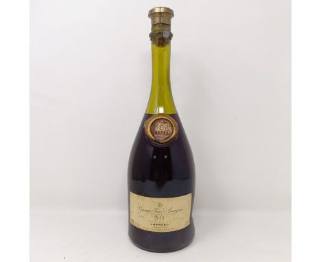 A bottle of Janneau 50 years aged Grande Fine Armagnac, 69 cl, 42% Alc vol.