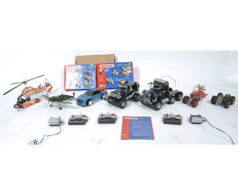 A collection of original Meccano made construction toy built vehicles comprising a WWII Spitfire, Rescue Helicopter, American