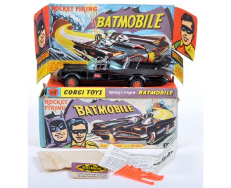 A original vintage boxed Corgi Toys diecast model No. 267 ' Rocket Firing Batmobile ' with Batman and Robin figures. The mode