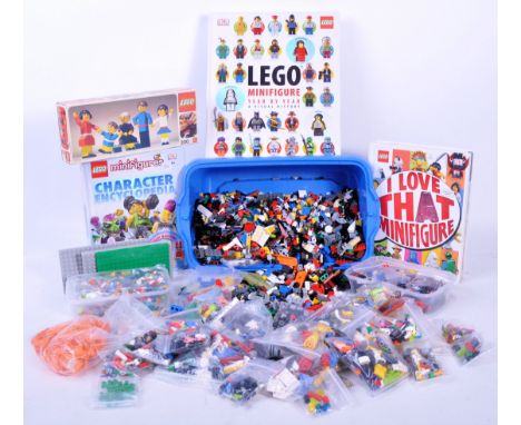 A large collection of assorted Lego books, brick parts and accessory pieces comprising x3 Lego Minifigure encyclopaedia, x1 v