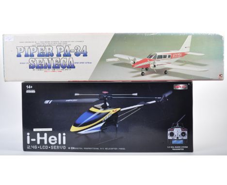 Two large scale radio controlled RC aviation interest models comprising MJX Toys made F49 single rotor helicopter and a Japan