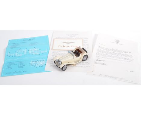 A Franklin Mint made 1/24 scale precision diecast model Jaguar SS 100. Cream, with highly detailed features and interior. Mod