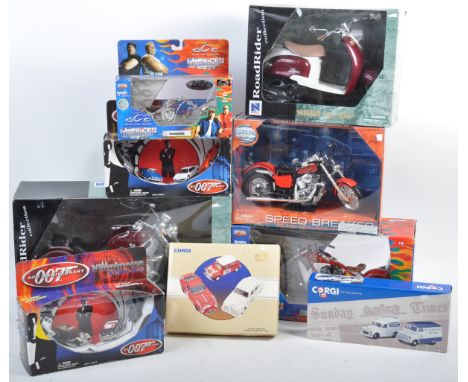 A collection of x9 assorted boxed diecast model cars and motorbikes of various scales and makers comprising Corgi, New Ray, J