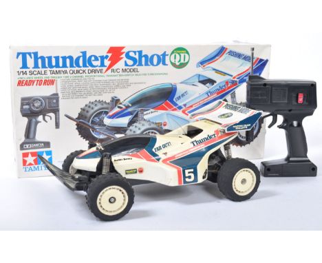 An original vintage Tamiya made 1/14 scale RC radio controlled car model No. 46001 ' Thunder Shot '. Model appears largely co