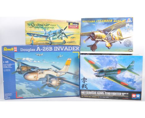 A collection of x4 assorted boxed plastic model kits of aviation interest to include Tamiya 1/32 scale Mitsubishi A6M5 Zero F