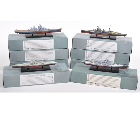 A large collection of x8 Atlas Edition scale model battleships each mounted on a plastic display plinths comprising models No