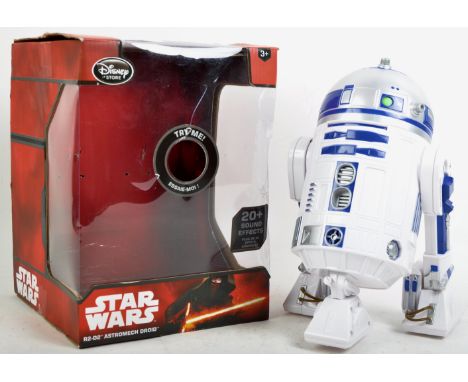 A Disney Store made Star Wars R2-D2 interactive Droid boxed toy action figure. The battery operated figure having sound-activ