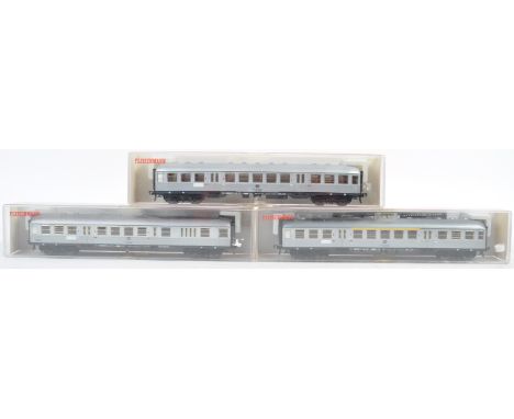 A collection of x3 Fleischmann made HO / 00 gauge model railway trainset locomotive carriages comprising models No. 5120, 512