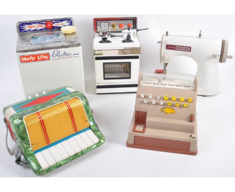 A charming collection of vintage boxed traditional children's toys to include Jones Meccano sewing machine, Hero accordion, C