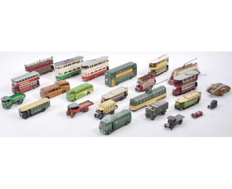 A collection of vintage 1/76 scale 00 gauge model kits comprising plastic and white metal examples. Includes bus, tram, steam