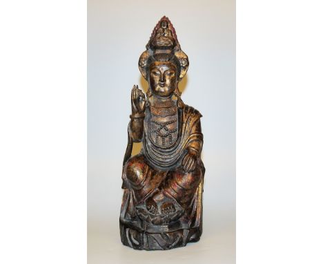 Elegante Statue der Guanyin, Qing-Zeit, China 18./19. Jh.Die "Göttin der Barmherzigkeit", mit verschränkten Beinen auf Felsen