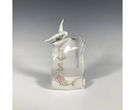 A glossy figure of a scroll with a rose and dove perched on it. 1999 Membership Gift. Lladro backstamp. This item has its ori