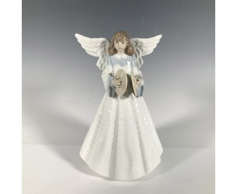 Glossy finished figure of an angel dressed in white with blue accents at her neck and hands. Lladro backstamp. This item has 