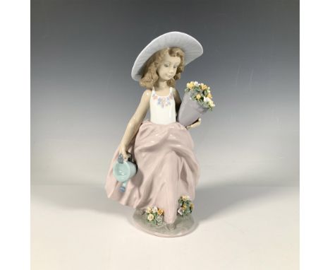 A glossy figure of a young girl in a dress, holding a pot of flowers and a watering can. 1999 Collectors Society Piece. Lladr