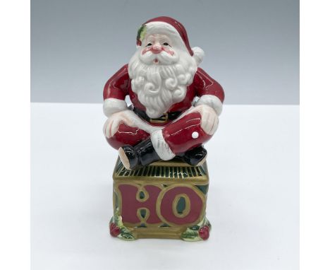 A duo of holiday shakers. Includes a Santa Claus and a Ho, Ho, Ho, cube that functions as a base. This item has its original 
