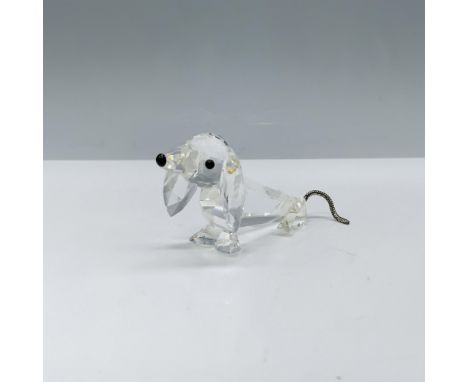 Figure of a cute dog with a clear faceted body and black eyes and nose. There are three different variations of this particul