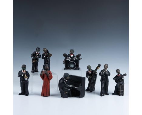 Marvelous set of jazz playing figures that consists of a red dressed singer, a wind up pianist, a guitarist, a drummer, a pic
