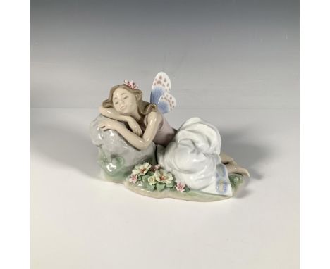 A glossy figure of a fairy taking a nap on a rock. The second Annual Edition of the Lladro Privilege Collection in a series o
