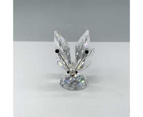 Hand assembled figurine with a small rhodium antenna and nose that is depicting a butterfly on a hill base. This version one 