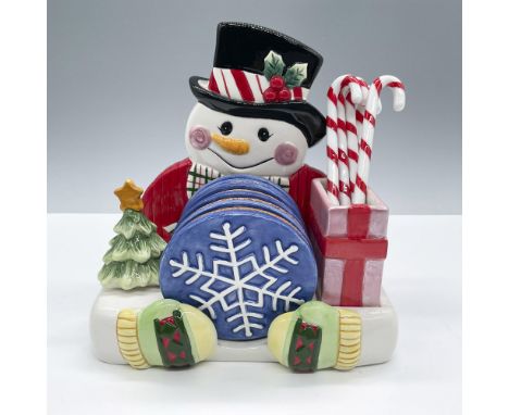 Adorable holiday set featuring a snowman holder with six snowflake coasters and six candy cane stirrers. Complete set measure