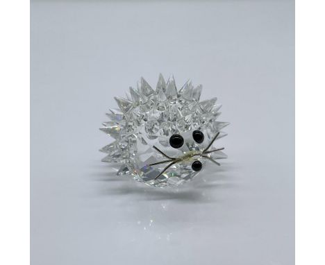 This adorable figure is made from clear crystal, with black eyes and nose, pointed spikes, and silver metal whiskers. This it