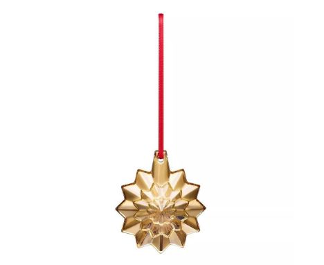 Annual edition radiant starburst shape, gilded with 20K gold to add a touch of luxury and brilliance to holiday decor. Engrav