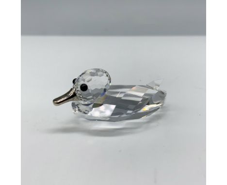 Adorable figure of a mini duck made from clear facetted crystal with black eyes and a silver colored metal bill. This figure 