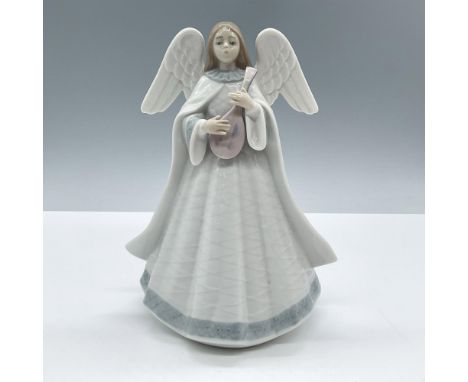 Glossy porcelain holiday Christmas figure of a young lady angel in a white dress with blue accents playing a mandolin. Lladro