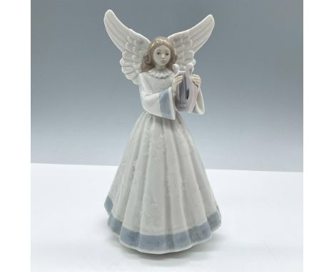 Glossy porcelain holiday Christmas figure of a young lady angel in a white dress with blue accents playing a harp. Lladro bac