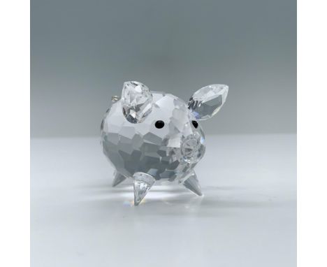 A clear crystal figure of a pig standing on all fours with black crystal used for the pupils. Swarovski swan mark. This item 