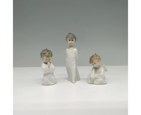 Three miniature angels in pristine white robes. Lladro backstamp. Tallest angel measures: 1"L x 3.75"W x 1.25"H. This item ha