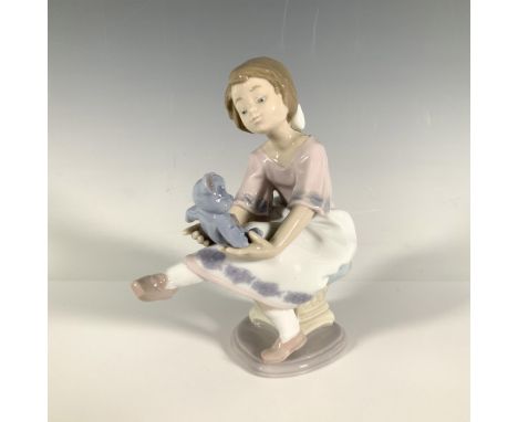 Glossy figurine from the Collectors Society in 1993. Depicts a seated girl playing with the blue teddy bear on her lap. Lladr