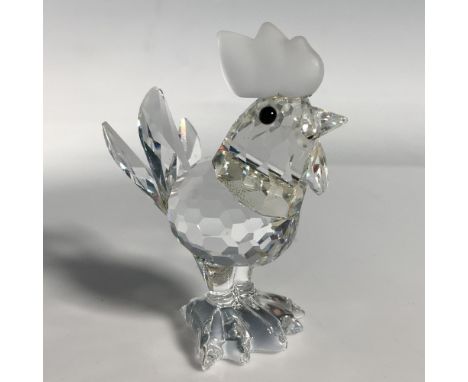 This retired rooster figurine is made from clear facetted crystal with black eyes and a frosted comb. Swarovski acid mark. It