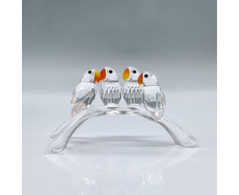 Features faceted clear crystal Lovebirds perched on a frosted arched branch with fire opal crystal beaks and Jet black eyes. 
