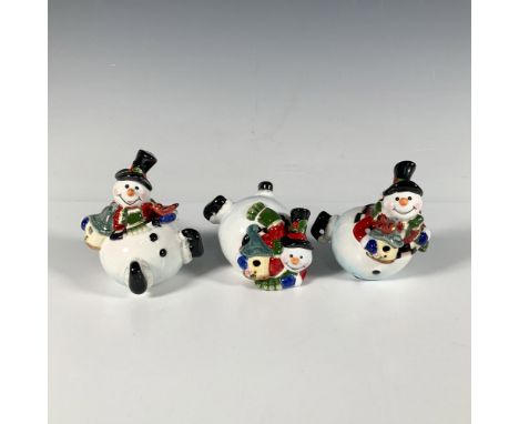 A set of three glossy snowman figures, each in a cute and jolly pose. Fitz and Floyd backstamp. Largest figurine: 3"L x 2.25"