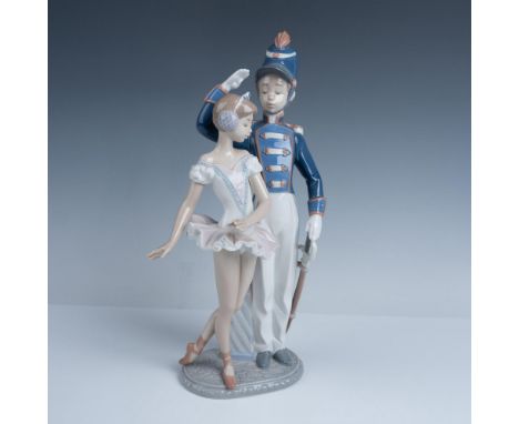 Glossy finish. Figure of a ballerina with a soldier in uniform. Lladro backstamp. This item has its original box. Box measure