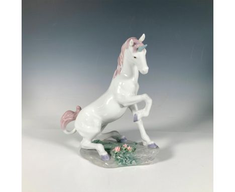 A glossy figure of a mythical horse holding, sitting on a rock base adorned with pink flowers. Third and last sculpture in th
