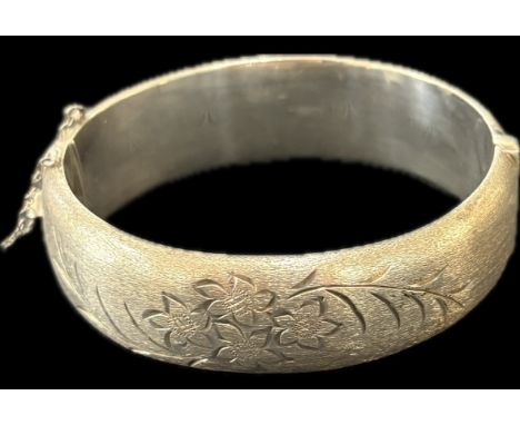 Ladies hallmarked silver bangle with floral motif, approximate weight 27g