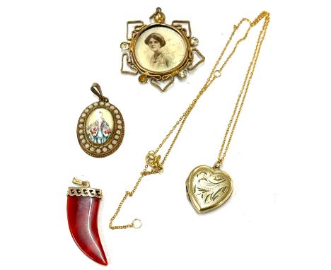 selection vintage pendants to include a rolled gold piece 