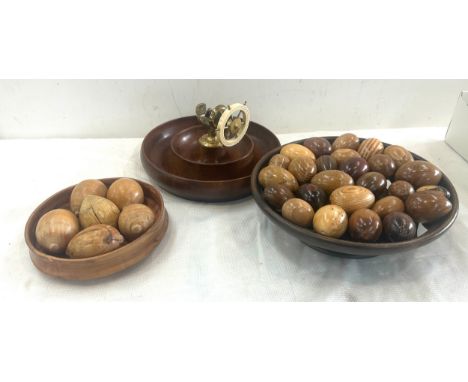 Treen corkscrew nut cracker, 2 bowls of wooden eggs
