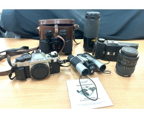 Canon AE1 Program 35mm Camera, Miranda 58mm Skylight filter, Miranda 35-70mm lens, Seal binoculars model DS066888, King Pengu