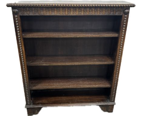 Solid oak four shelf book case, does have some beading missing  measures approximately 42 inches tall x 37 wide and 10 deep