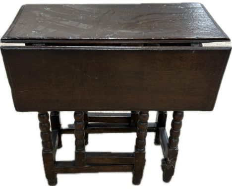 Antique period gate leg bobbin legged table with drawer measures approximately 27 inches tall 30 inches wide 26 inches depth 