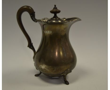 A silver baluster shaped hot water pot, ebonised finial, Birmingham 1936, 412g gross, approx
