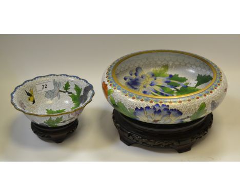 A cloissone enamel circular bowl, decorated with flowers and birds, white ground, wooden stand, 26cm diameter;  another small