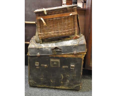 A domed topped wicker travel trunk; a wicker fishing basket 
