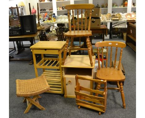 A pair of pine stick-back chairs; a pine magazine rack; a rush seated collapsable stool; a bedside cabinet; a pine kitchen bl