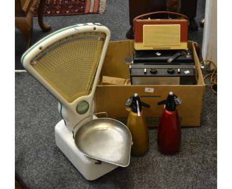 A Pye transistor radio; others Discotran; Philco; others; a soda syphon; another ; an Avery shop scale