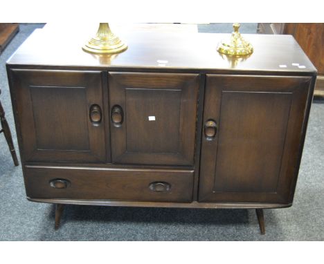 An Ercol (Blue Label) sideboard, three cupboard doors, single short drawer